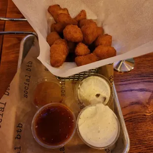 Fried cheese curds with ranch and mango habanero sauces