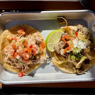 Carnitas taco and a Carne Asada taco.