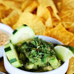 a bowl of guacamole and chips