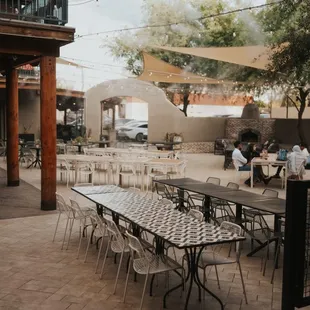 Our courtyard - available for private events. Comes with a private bar, stage, firepit, and fireplace. Misters  to keep you cool!