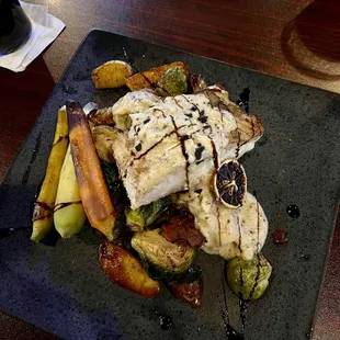 Halibut, fingerling potatoes, carrots, onions, with crab cream sauce.