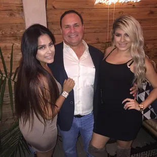 a man and two women posing for a picture