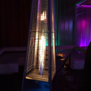 a gas heater in a dimly lit room