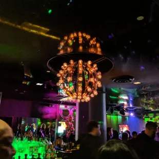 a crowd of people at a bar