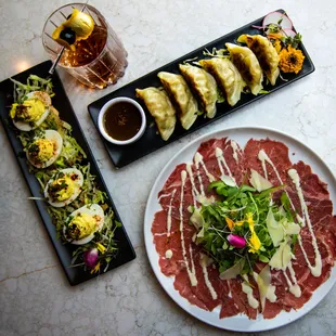 Carpaccio, deviled eggs, and potstickers.