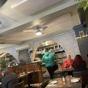 people sitting at tables in a restaurant