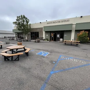 picnic tables in parking lot
