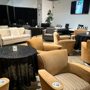 lounge area with tables and chairs