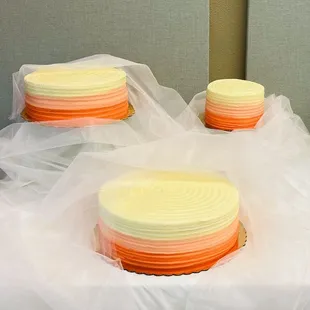 three cakes on a table