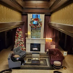 a living room with a christmas tree
