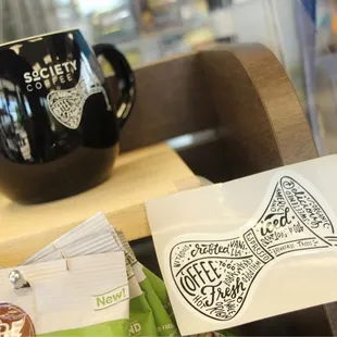 a cup of coffee and a sticker