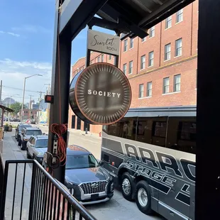 a view of a city street from a balcony