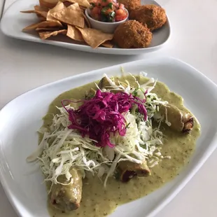 Potato tacos with tomatillo sauce and fried guac with chips