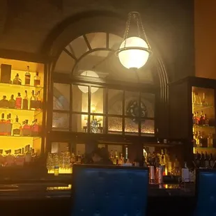 a woman watching television in a bar