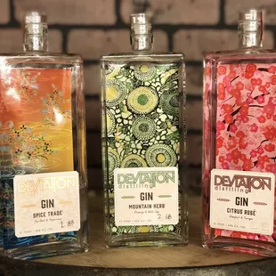 three bottles of gin