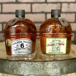 two bottles of cid on a barrel