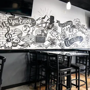 a black and white mural on the wall