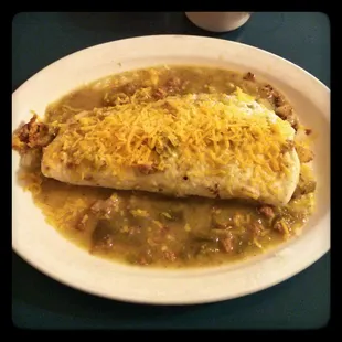 Bacon breakfast burrito smothered in green chile!