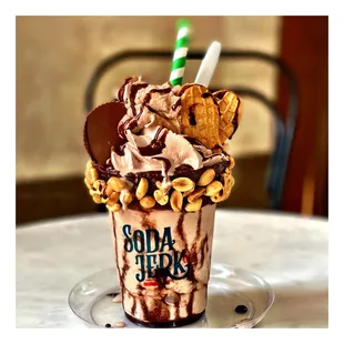 Peanut butter chocolate shake with Reese&apos;s peanut butter cup, nutter butter cookies, chocolate whip cream, hot fudge, peanuts.