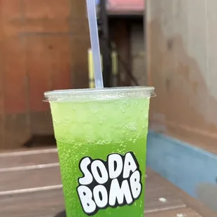 a drink in a plastic cup with a straw