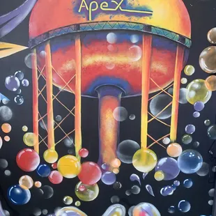 a colorful painting of a water tower