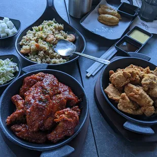 Yangnyeom and regular wings, shrimp fried rice and sides.