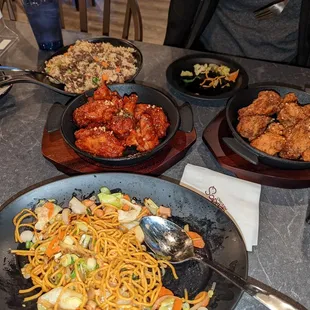 Half portion order of soy garlic, half portion order of Yang nyeom chicken, chicken yakisoba, and beef fried rice.