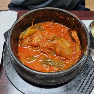 a pot of stew with vegetables