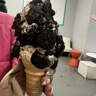 The large ice cream cone with Oreo cookie topping