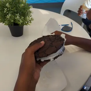 Ice Cream Sandwich made to order. Two brownie cookies with vanilla ice cream.
