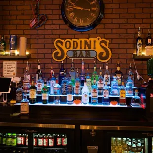 a bar with bottles of alcohol
