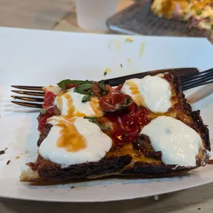 A piece of the Detroit rob city pizza - also 16 dollars for small (4 pieces)