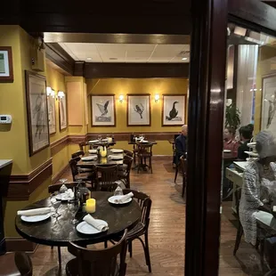 a dining room with tables and chairs