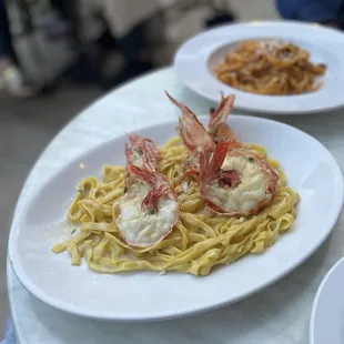 a plate of pasta with shrimp