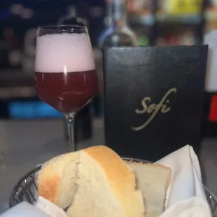 a glass of wine and bread