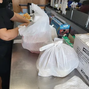 Two person checking system for our to-go orders