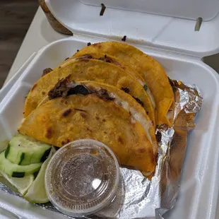 Quesa birria tacos with a side of broth that the meat was cooked in!