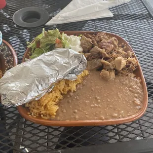 Carnitas with rice and refried beans