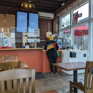 a woman standing at the counter