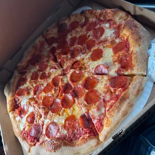 a pepperoni pizza in a box