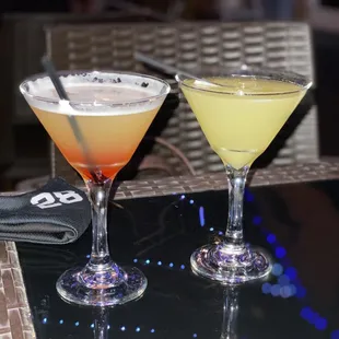 two cocktails on a table