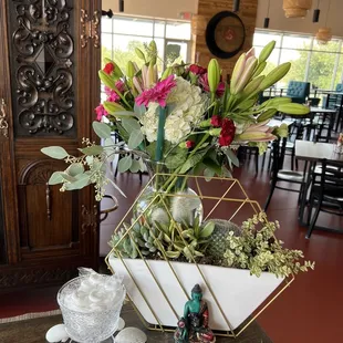 a vase of flowers on a table