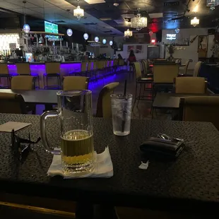 a glass of beer on a table