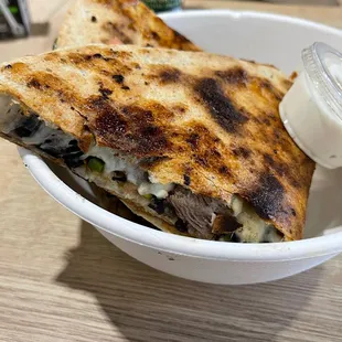 a plate of quesadillas with sauce