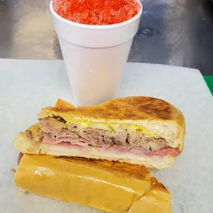a cuban sandwich paired with a cherry shaved ice!