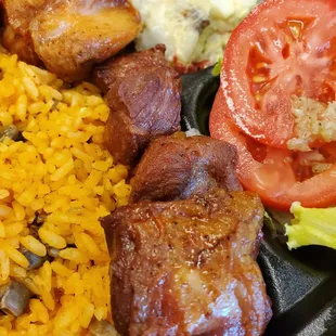 Carne Frita with Arroz con gandules (Fried porl cubes with yellow rice and pigeon peas)