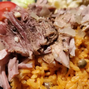 Mojo slow roasted pork with Puerto Rican style yellow rice and potato salad