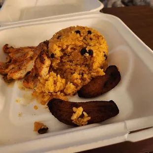 Rice bowl. Cold rice and overcooked and dry meat. And plantains.