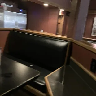 Section tables between booths where we sat. By kitchen area