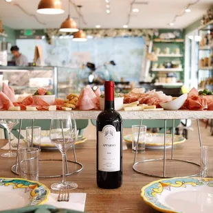 a table with a bottle of wine